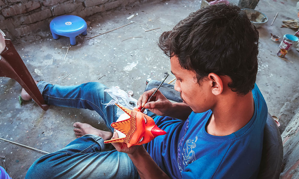 Artist Working on a Mask at Chamaguri Satra